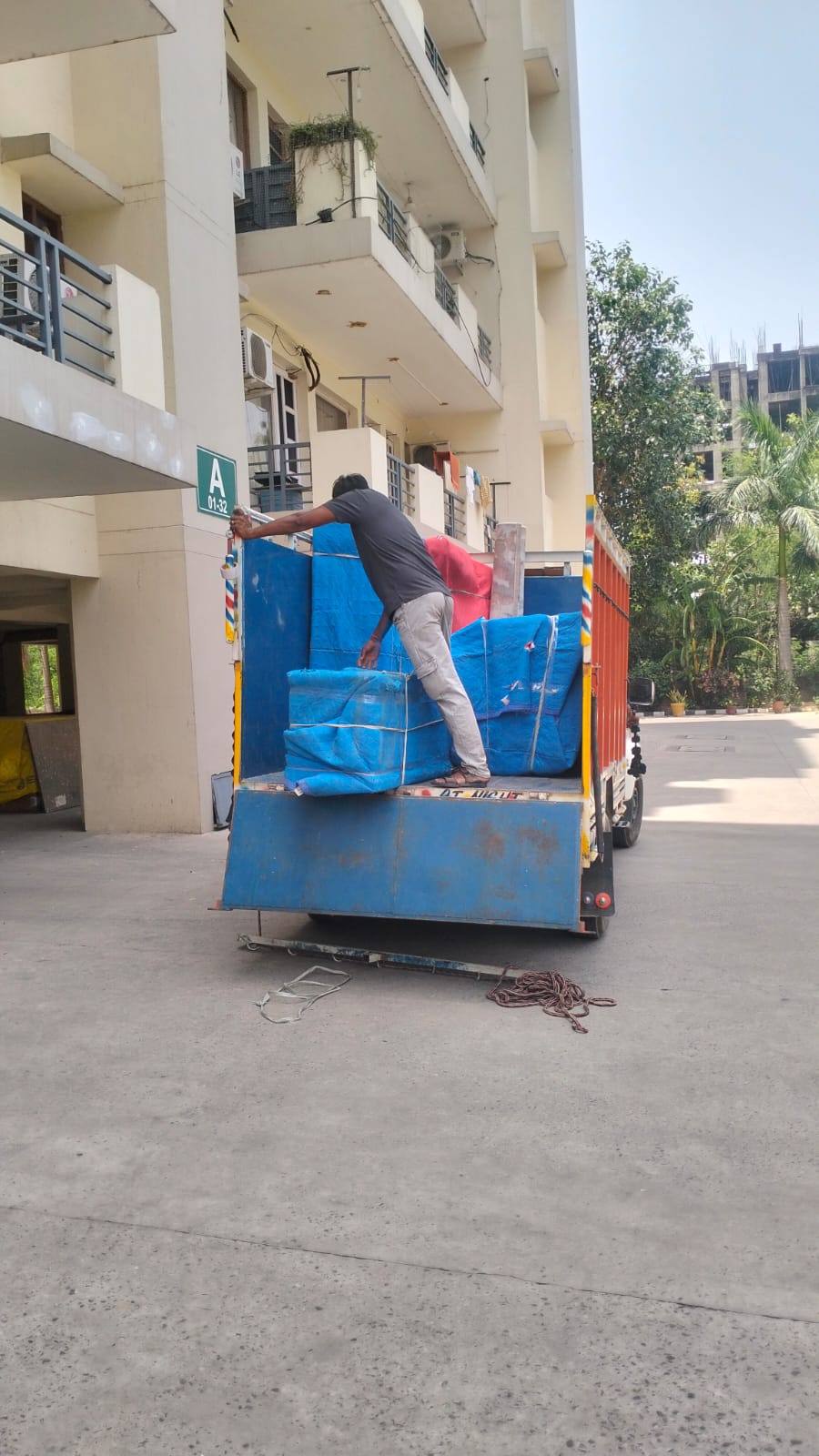 Wrapped furniture being loaded for a household move